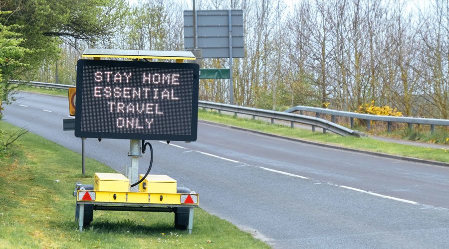 Sign during lockdown, "Stay home, essential travel only."