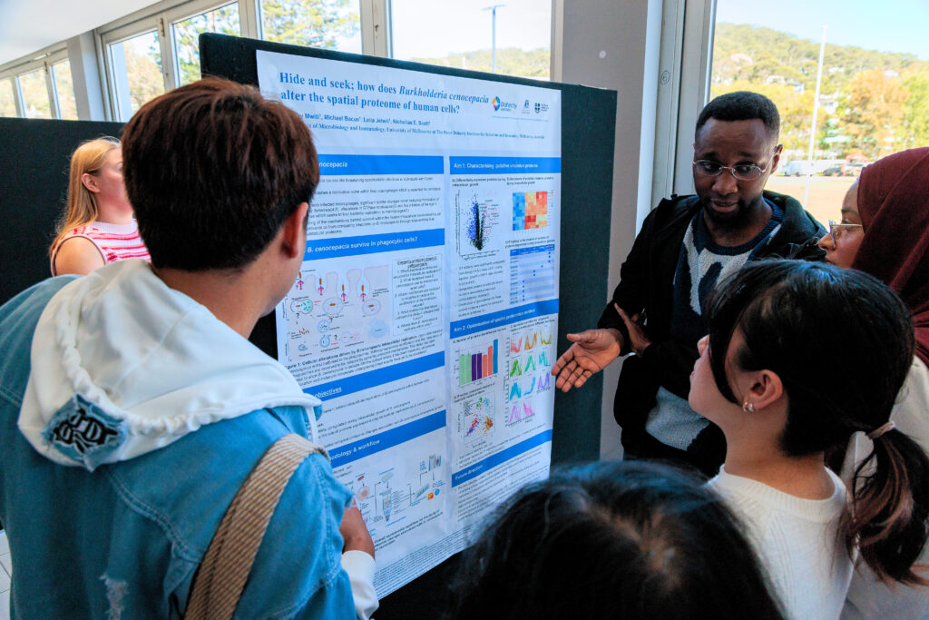 Group of people viewing scientific poster