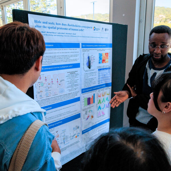 Group of people viewing scientific poster